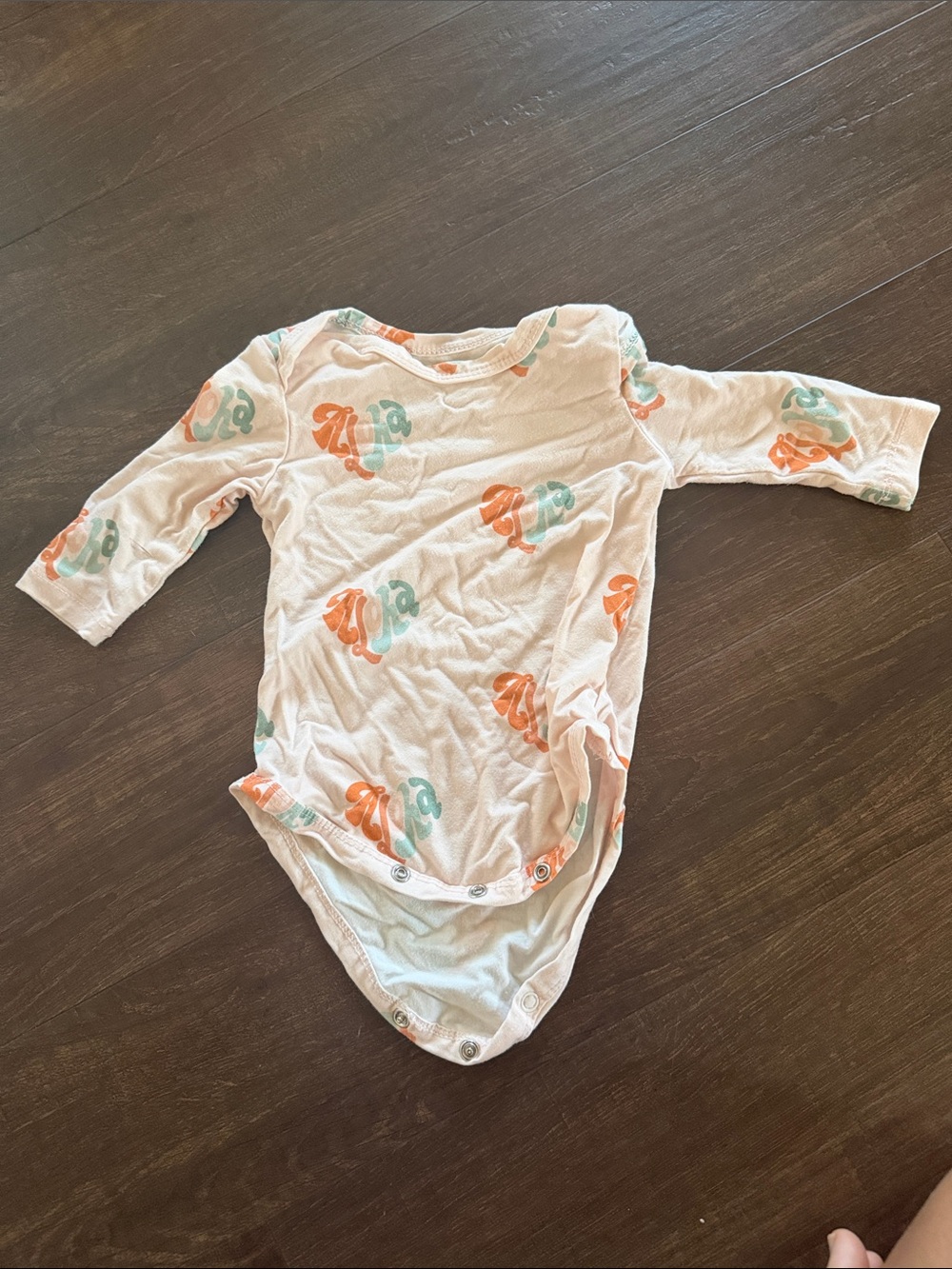 Soft Long-Sleeve Pink Baby One-Piece with Orange & Teal Print